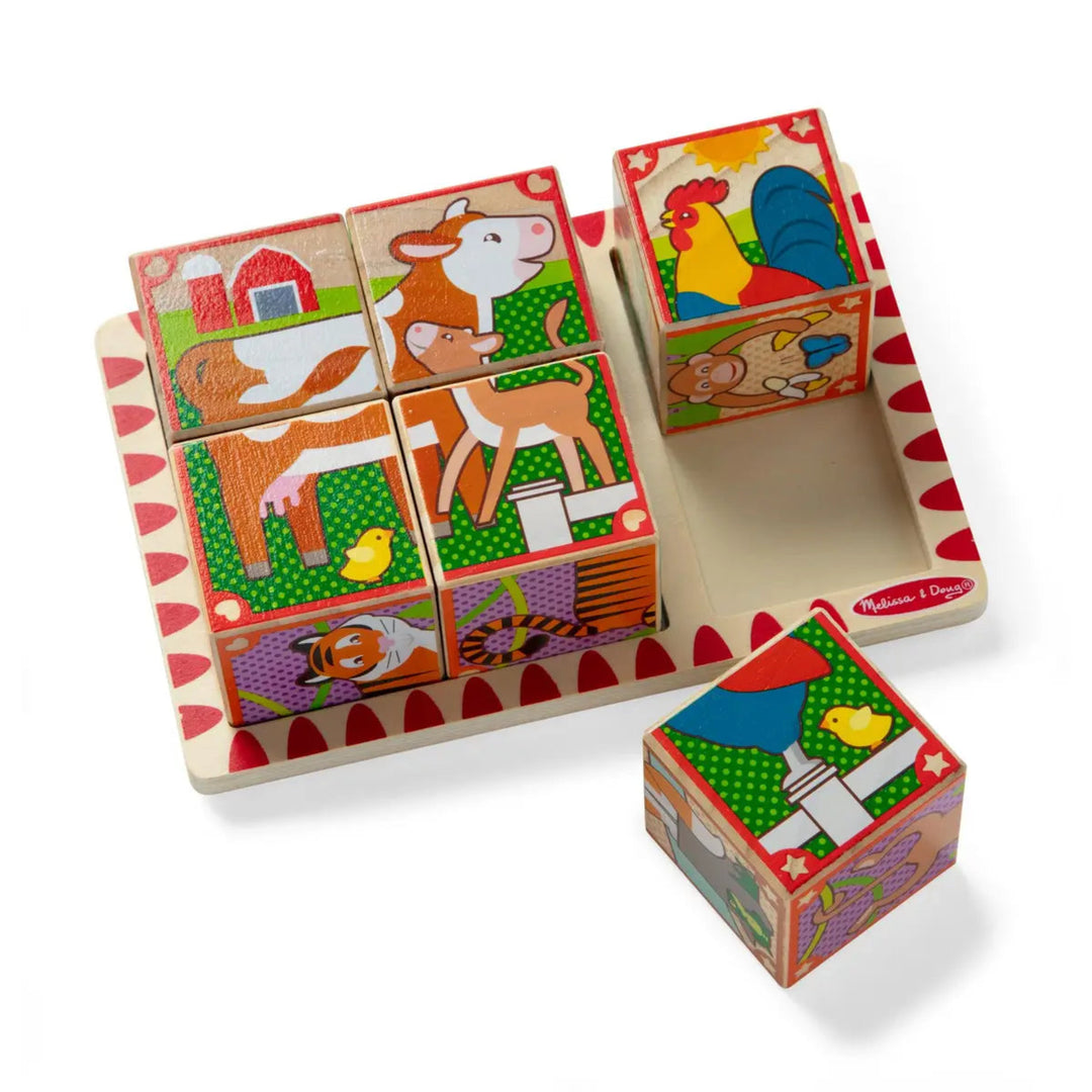 Set of wooden farm animal blocks with colorful illustrations on a white background