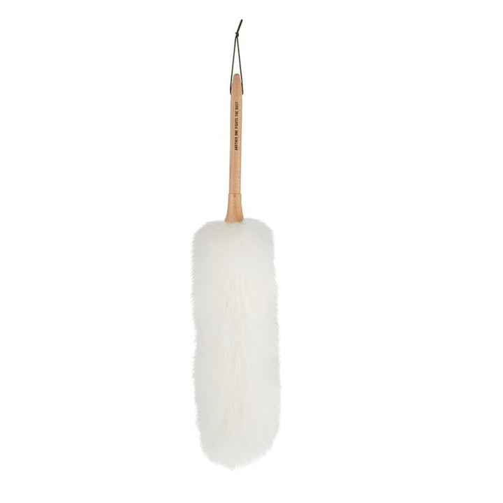 White feather duster with wooden handle on a white background