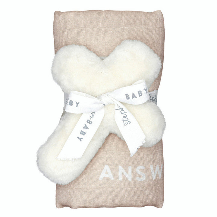 Baby blanket with white fluffy trim and 'Baby Answer' text on a beige background
