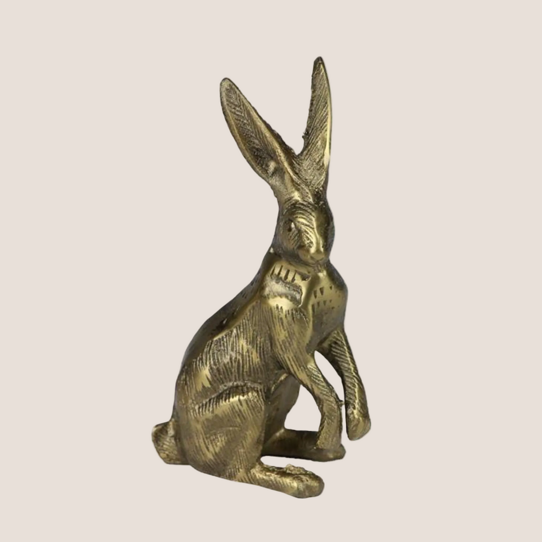 Bronze rabbit sculpture on a white background with product details overlay.