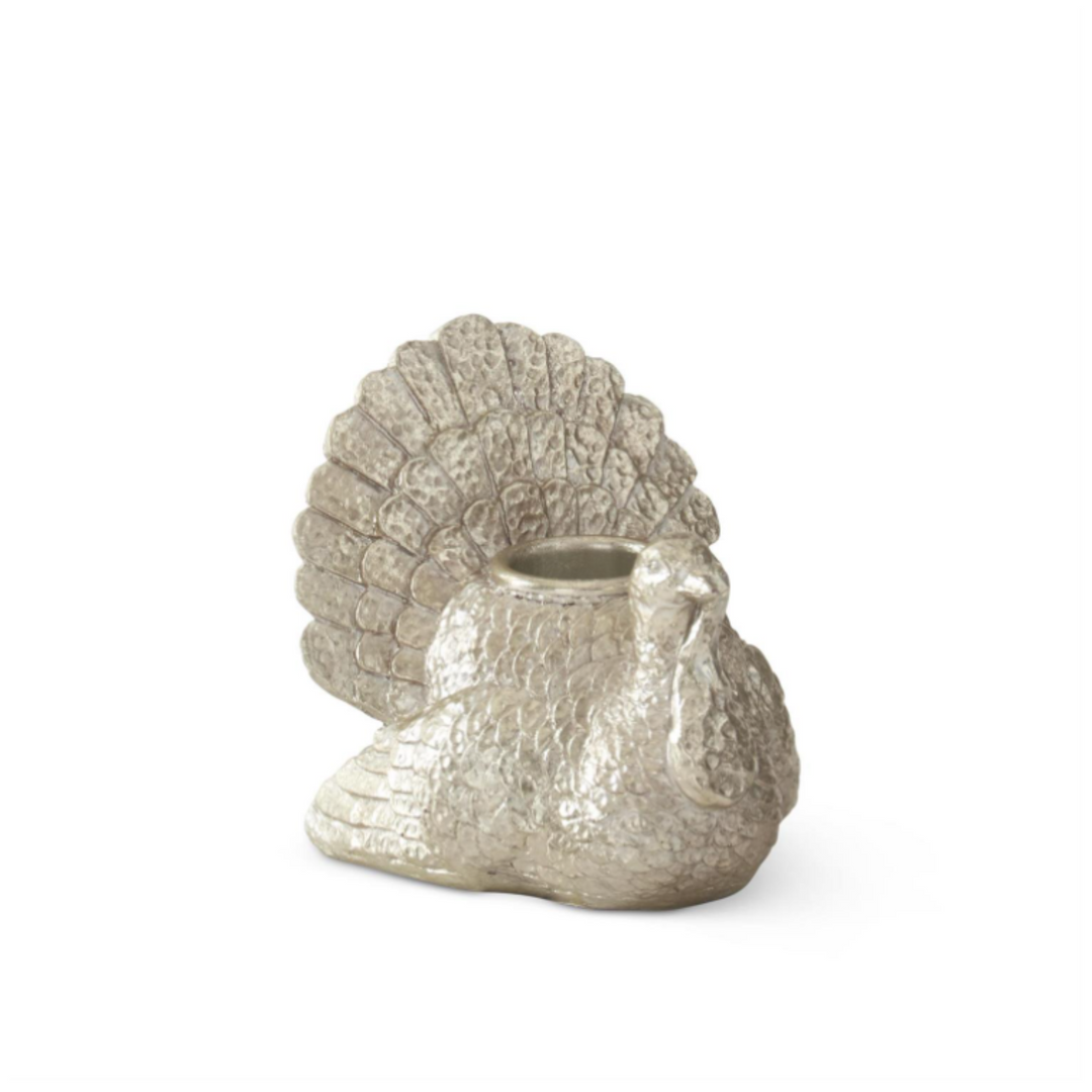 Decorative silver shell-shaped container on a white background