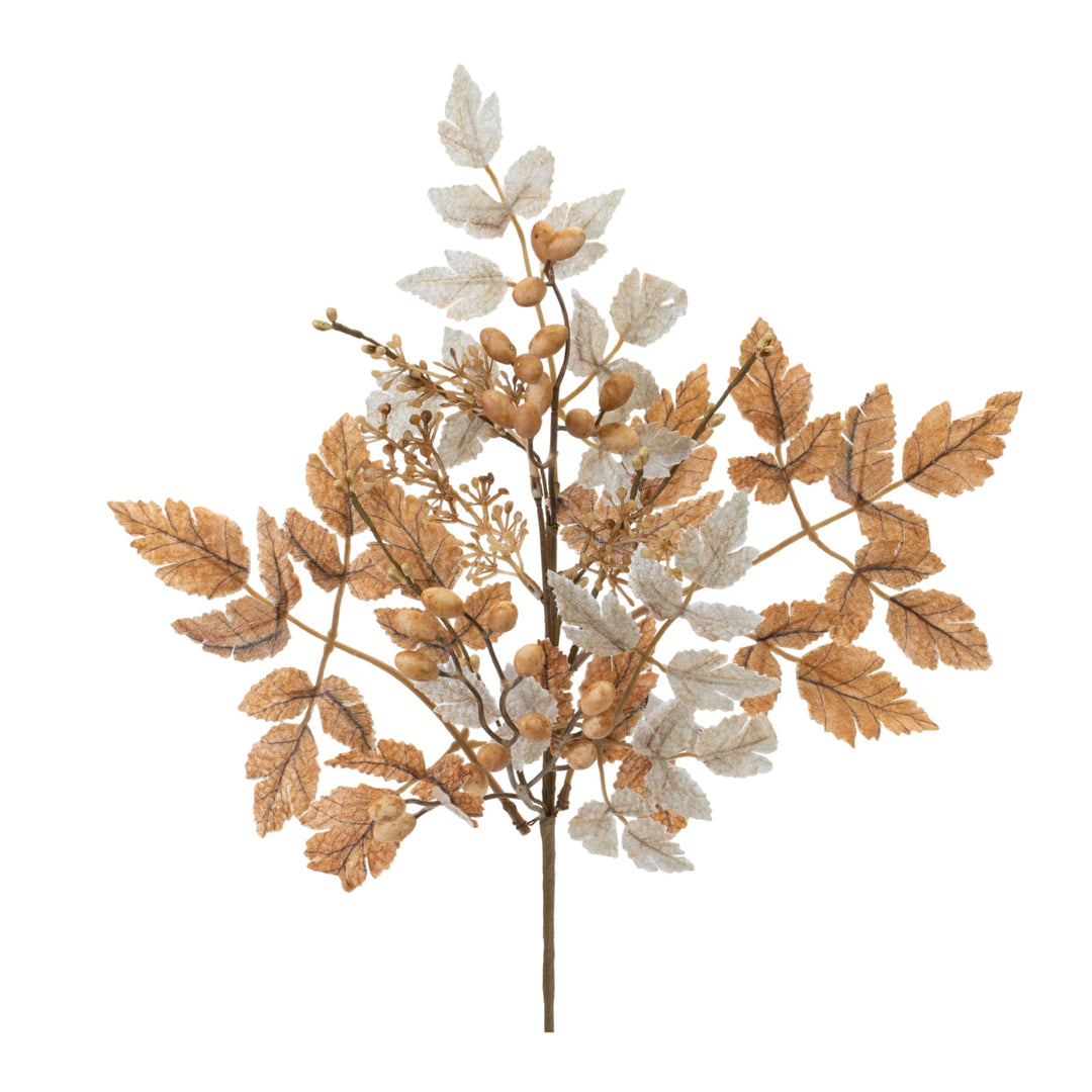 Decorative branch with gold and white leaves on a white background