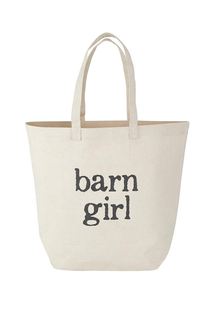 Beige tote bag with 'barn girl' text on a white background