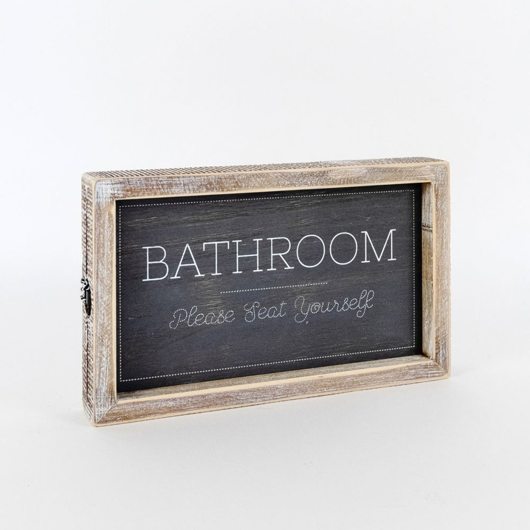 Wooden-framed sign with 'Bathroom Please Seat Yourself' text on a white background