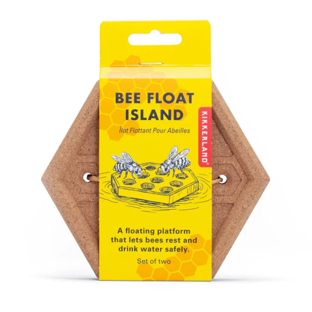 Kikkerland Bee Float Island set of two hexagonal cork bee floats in their original yellow cardboard packaging, shown on a clean white background.