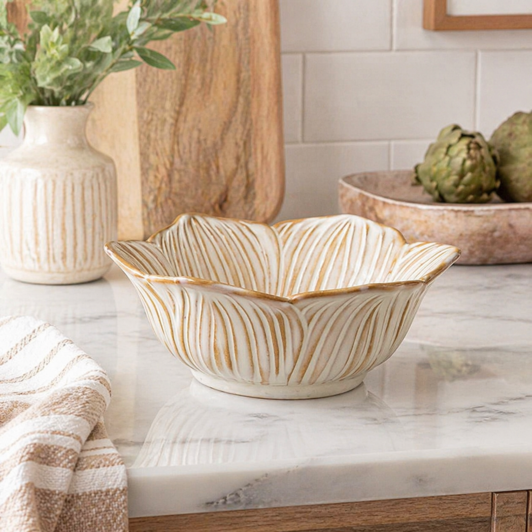 Decorative ceramic bowl with wavy pattern on a kitchen counter.