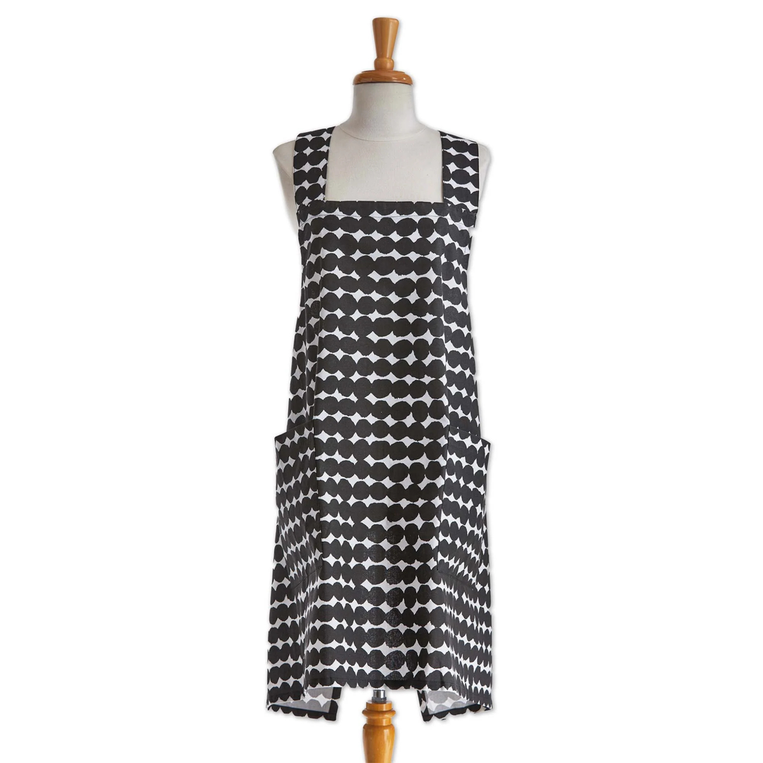 Black and white patterned apron on a mannequin against a white background