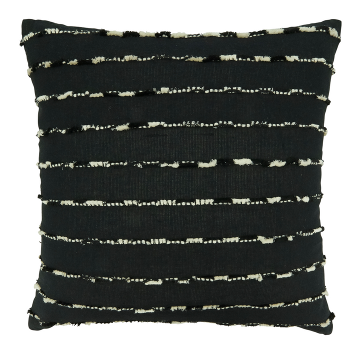 Black pillow with white abstract pattern on a white background
