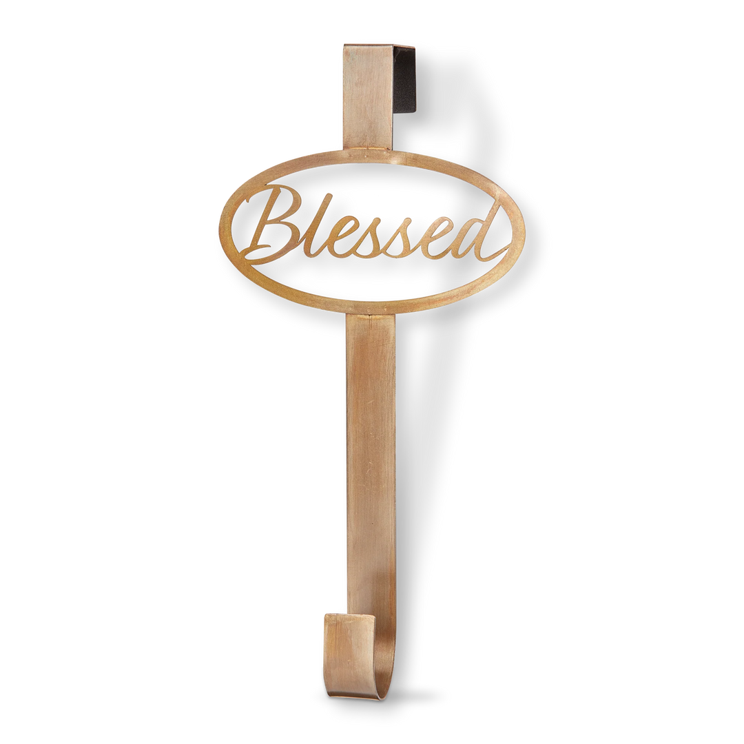 Decorative metal sign with 'Blessed' text on a white background