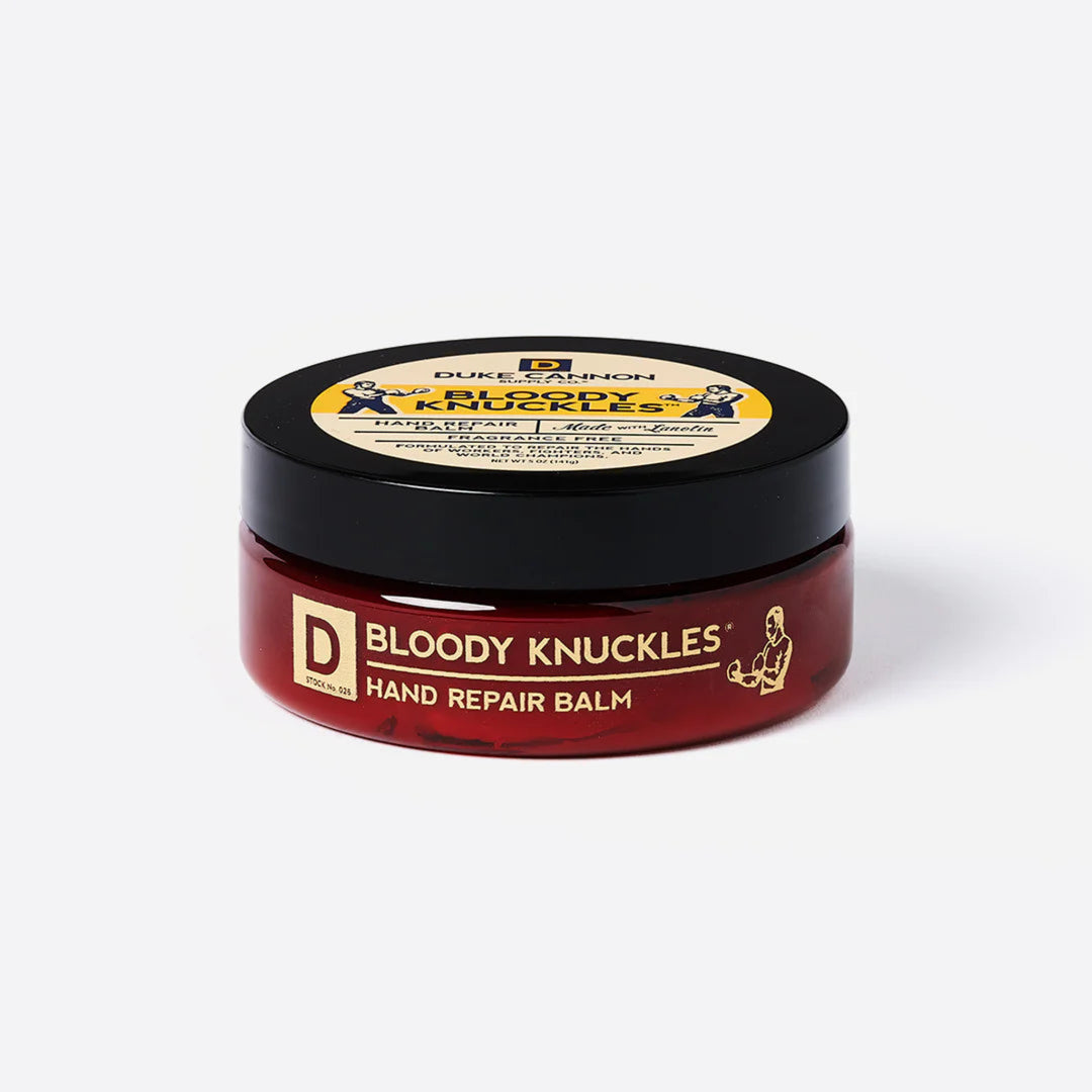 Jar of Bloody Knuckles hand repair balm with Duke Cannon branding on a white background