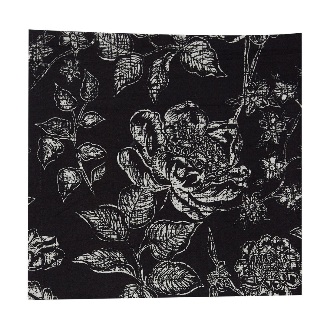 Black fabric with white floral pattern on a white background