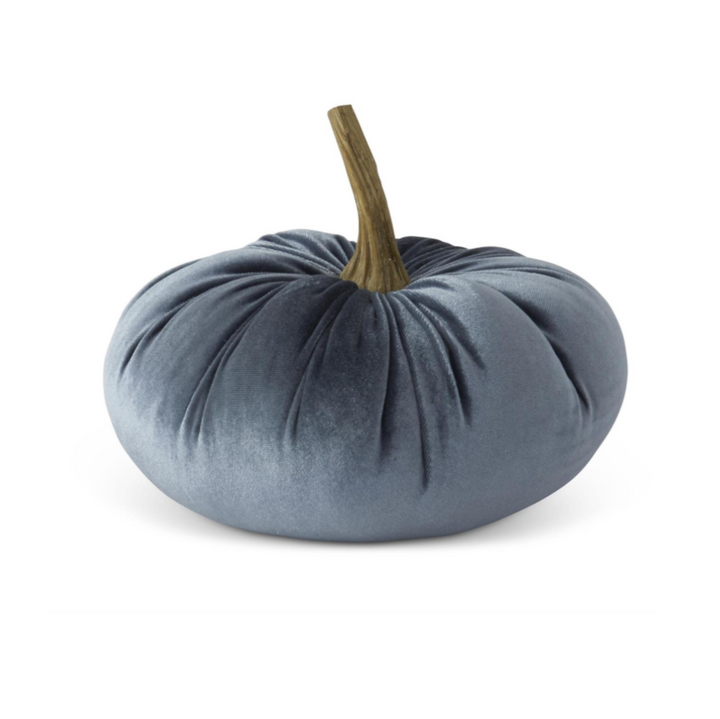 Blue velvet pumpkin-shaped pillow on a white background