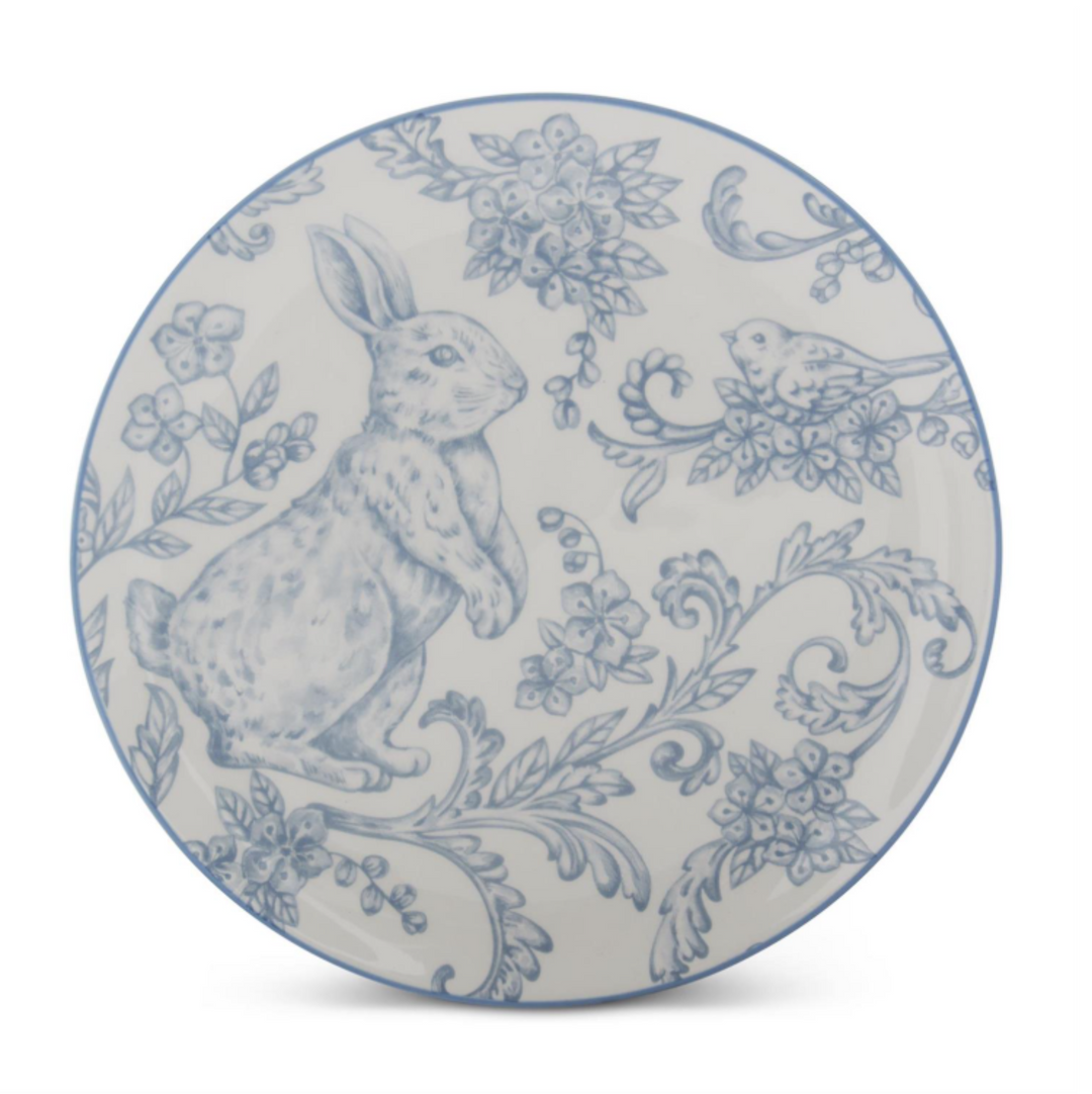 Decorative plate with blue rabbit and floral pattern on a white background