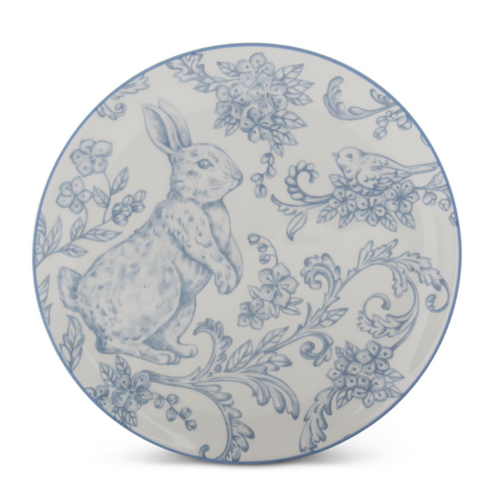 Decorative plate with blue rabbit and floral pattern on a white background