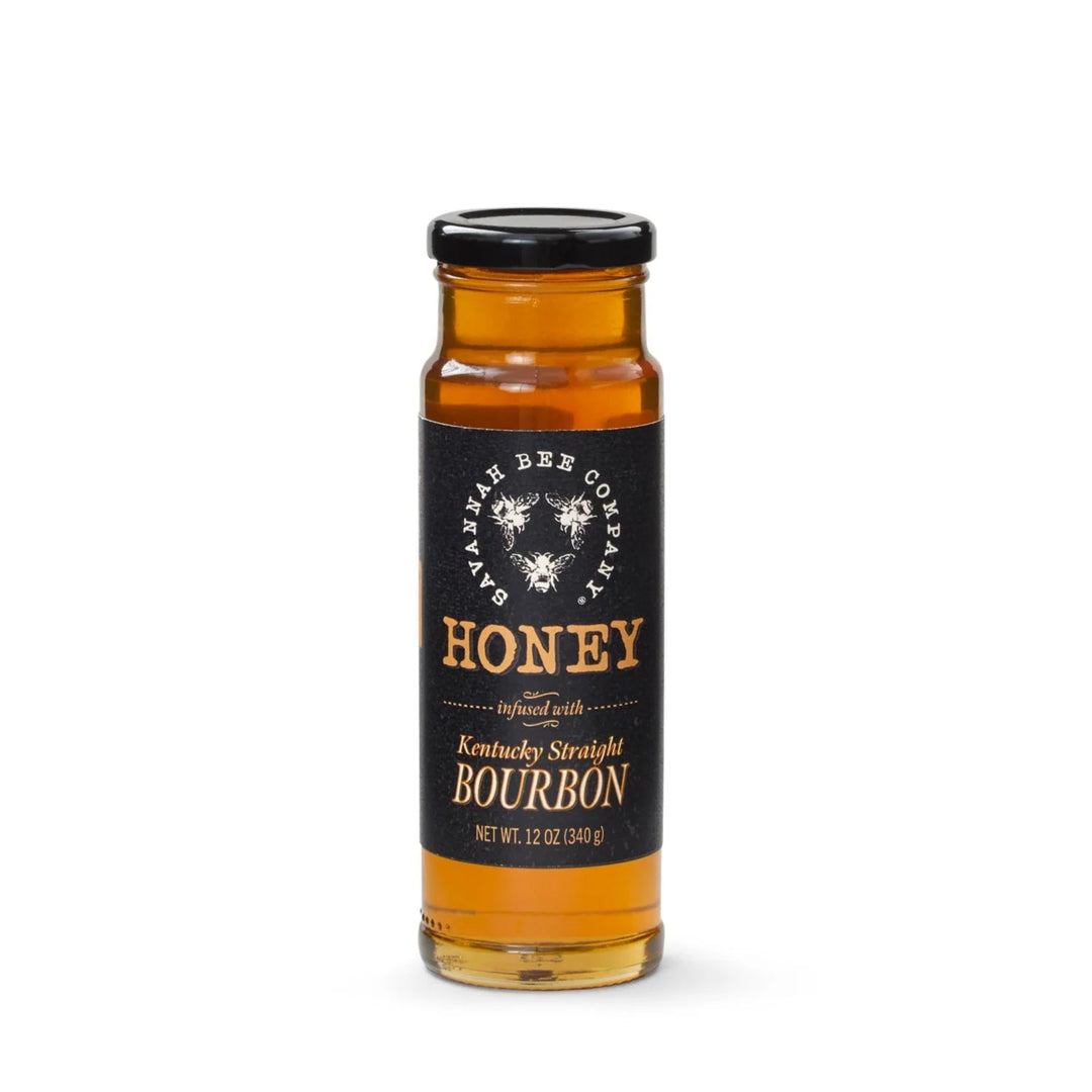 Bottle of honey bourbon with a black label on a white background