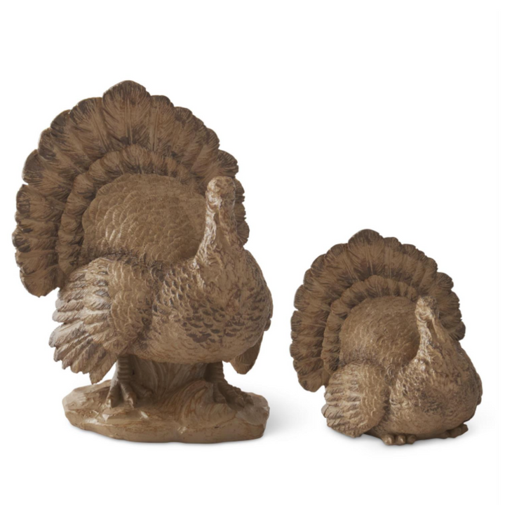 Two decorative turkey figures on a white background