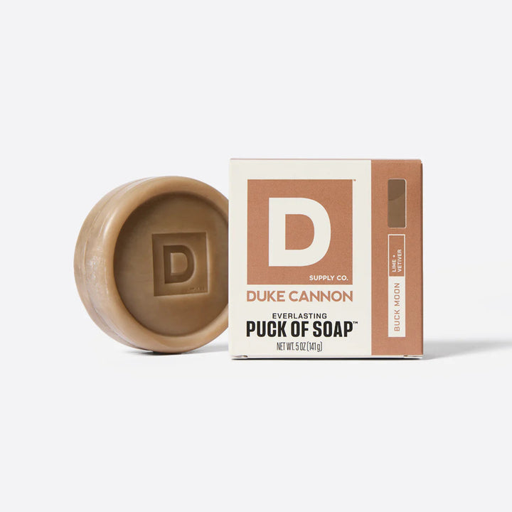 Duke Cannon soap puck and packaging on a white background