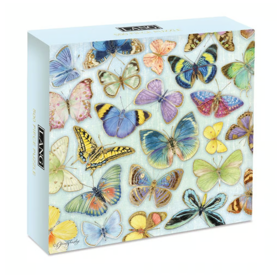 A boxed jigsaw puzzle featuring a colorful array of illustrated butterflies on the front, photographed on a clean white background. The brand name 'Lange' is visible on the side of the box.