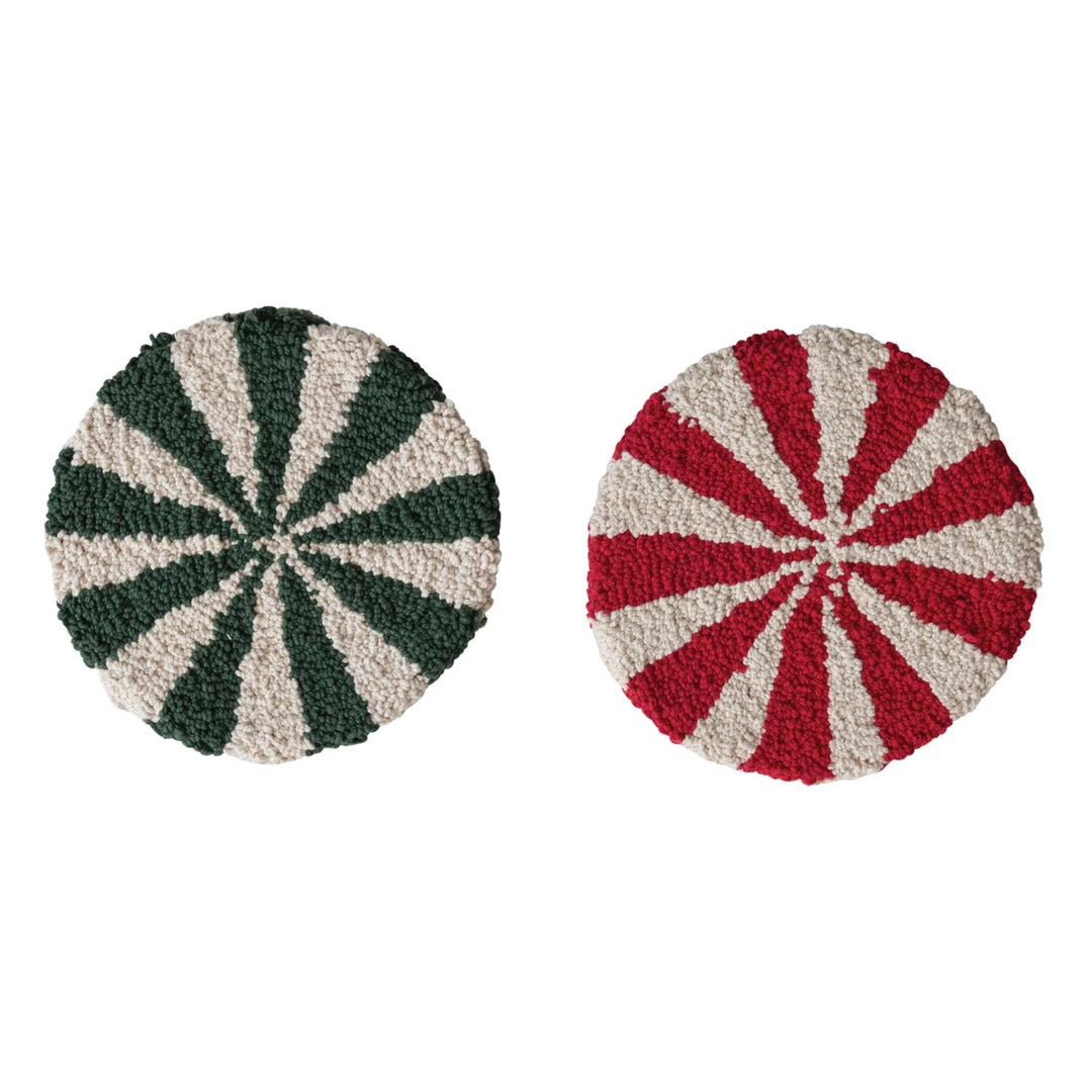 Two round doormats with striped patterns on a white background