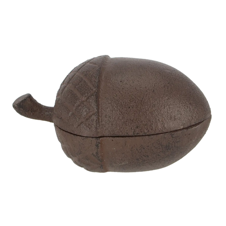 Brown ceramic acorn-shaped container on a white background