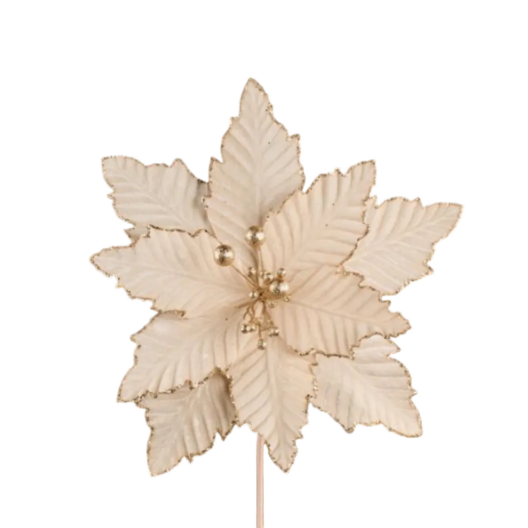 An off-white faux poinsettia flower topper with gold glittery edges and a gold stem, shown against a solid black background.