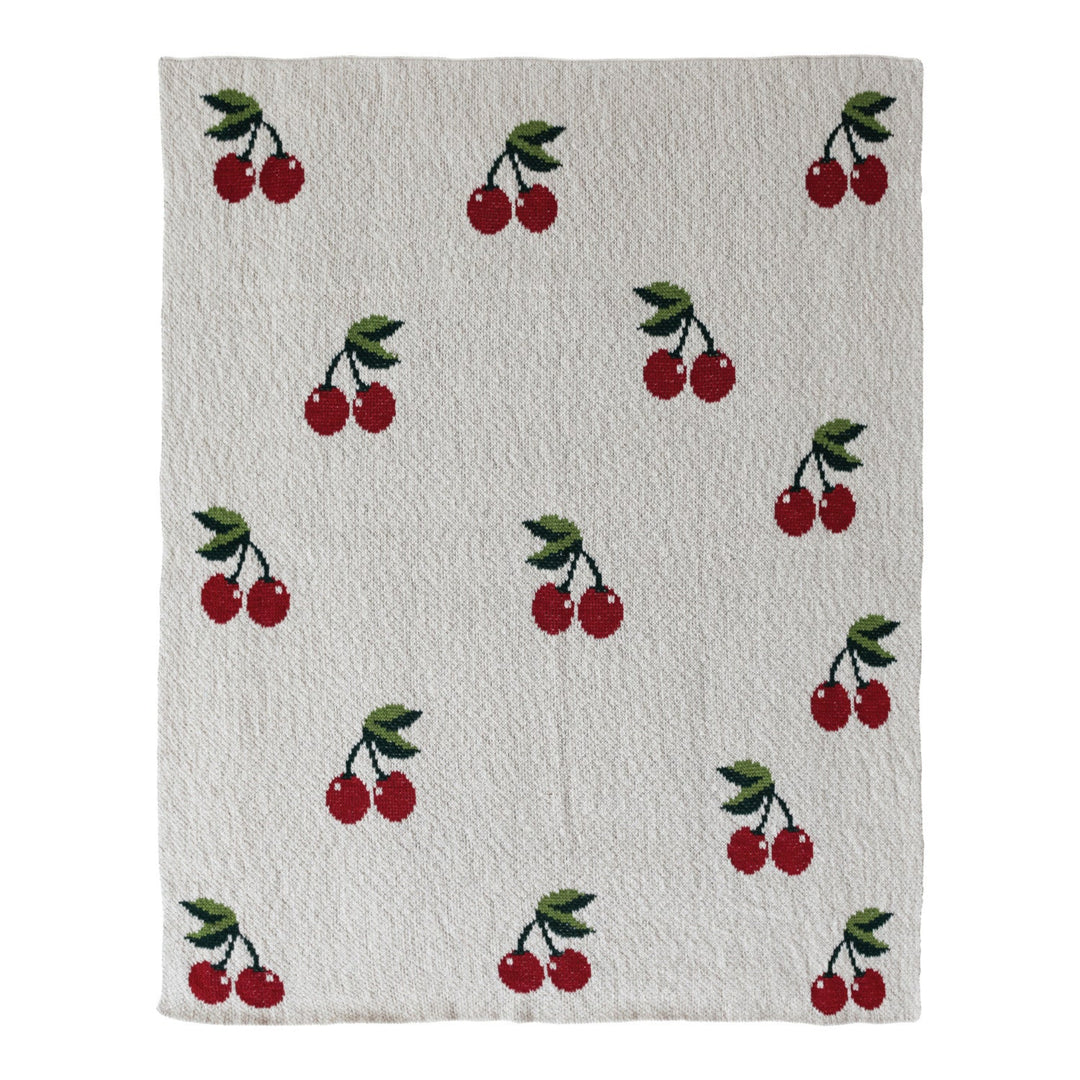 Textile with cherry pattern on a white background