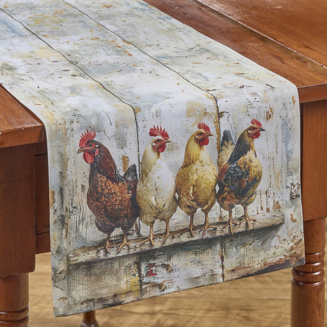Table runner with chicken design on a wooden table