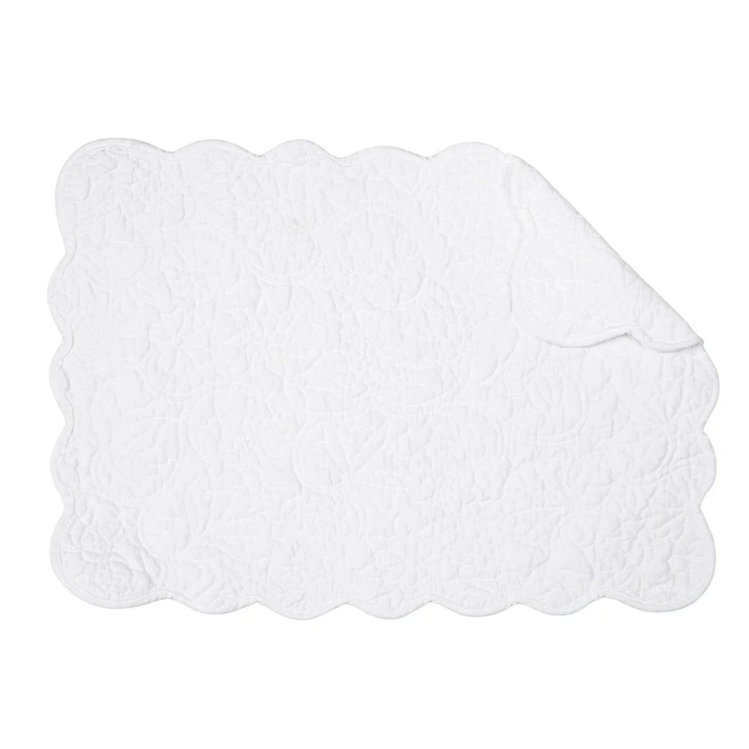 White scalloped placemat on a white background
