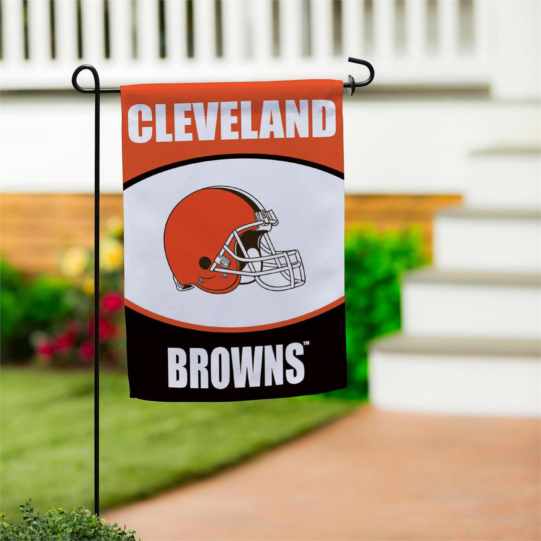 Cleveland Browns garden flag with helmet design on a blurred outdoor background
