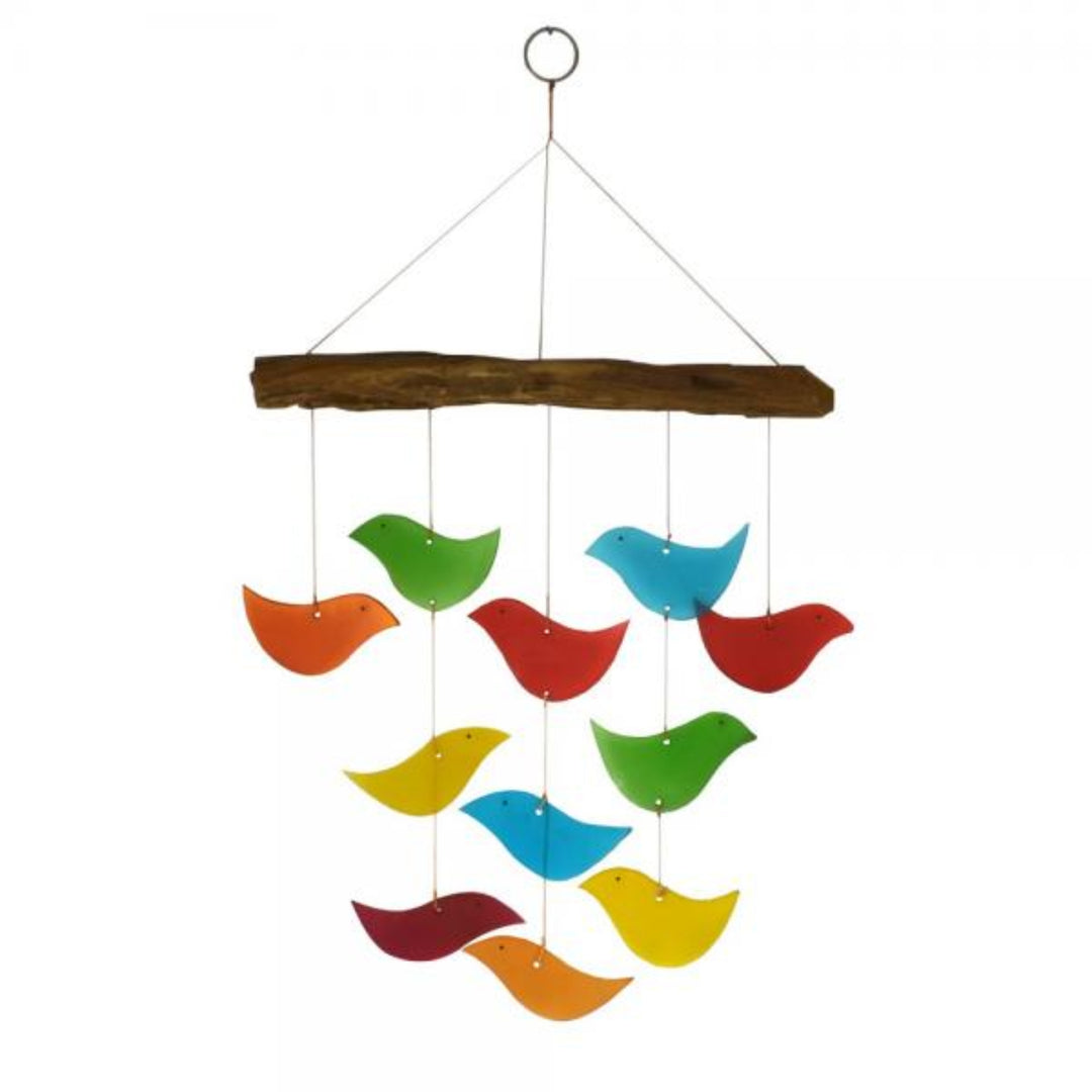 Colorful bird-shaped wind chime hanging from a branch on a white background