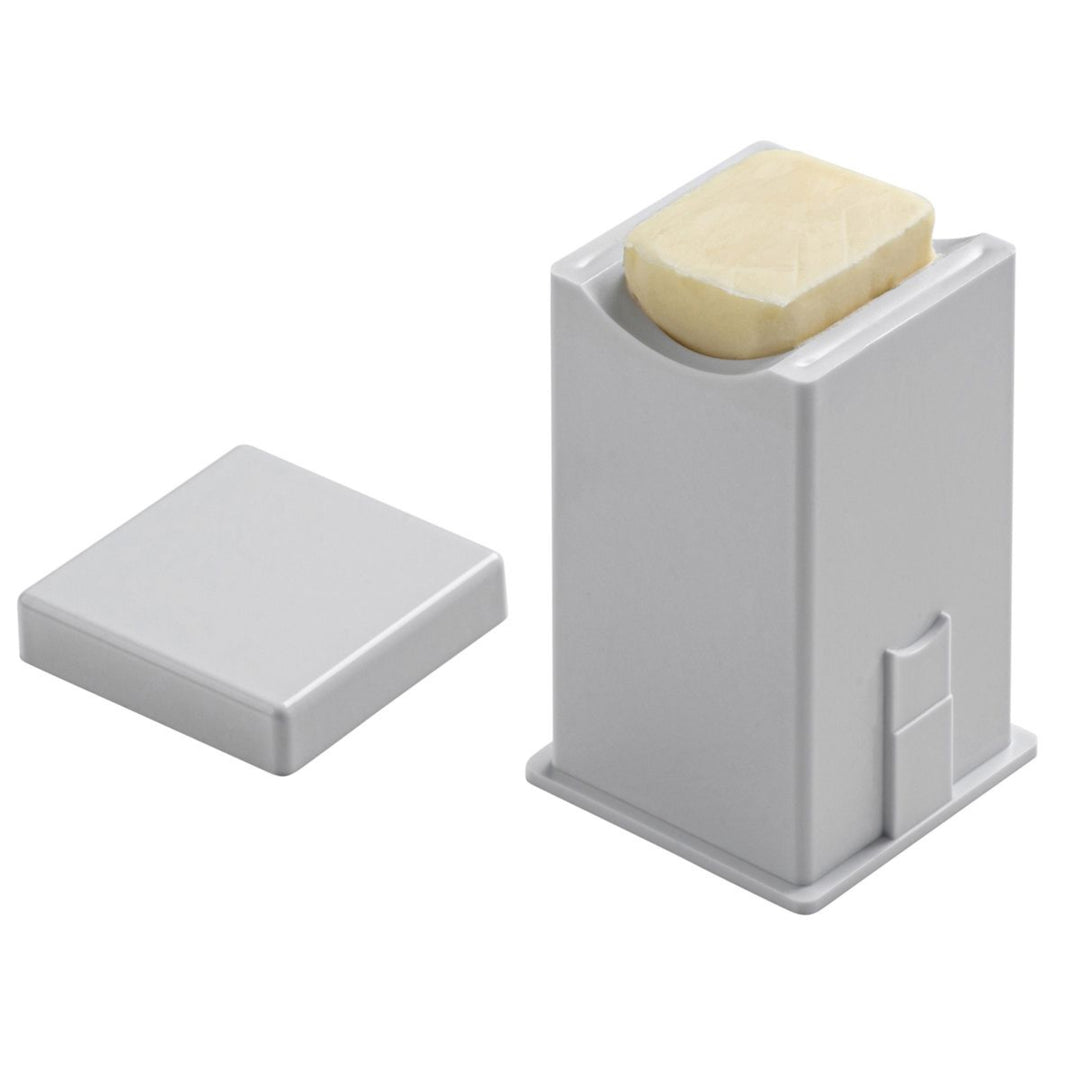 White soap holder with a bar of soap on a white background