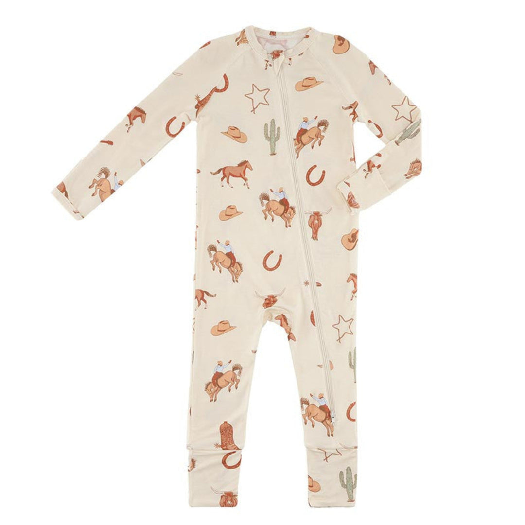 A baby's long-sleeve footless one-piece pajama or jumpsuit in cream with a western-themed print of brown horses, cowboy hats, horseshoes, cacti, and stars, shown flat on a white background.