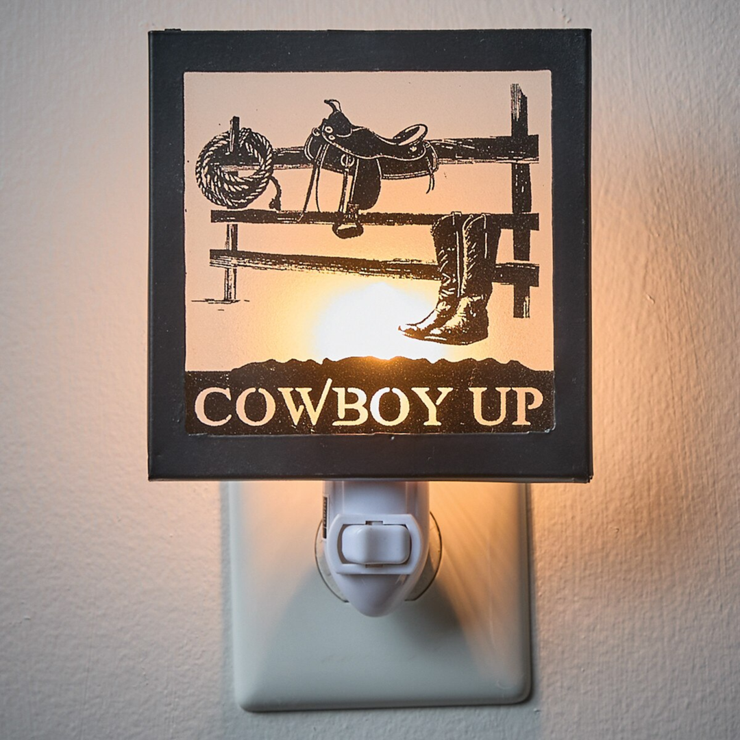 Night light with cowboy-themed design featuring a sunset, boots, and 'Cowboy Up' text.