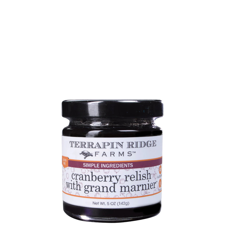 A jar of Terrapin Ridge Farms Cranberry Relish with Grand Marnier, featuring a black lid and a white label with orange and purple accents, set against a plain white background.