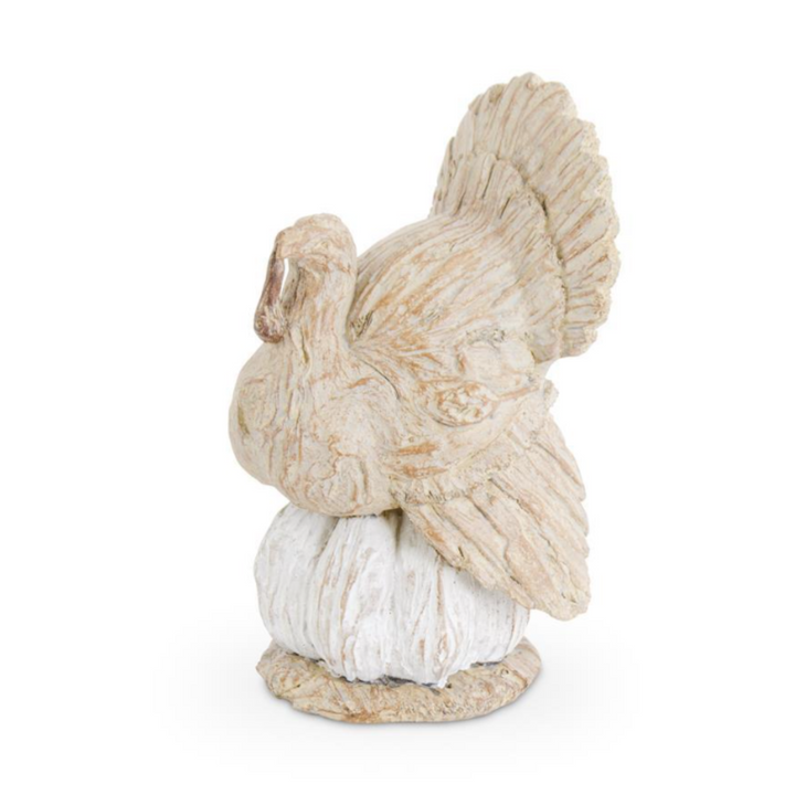Decorative squirrel figurine with textured fur on a white background