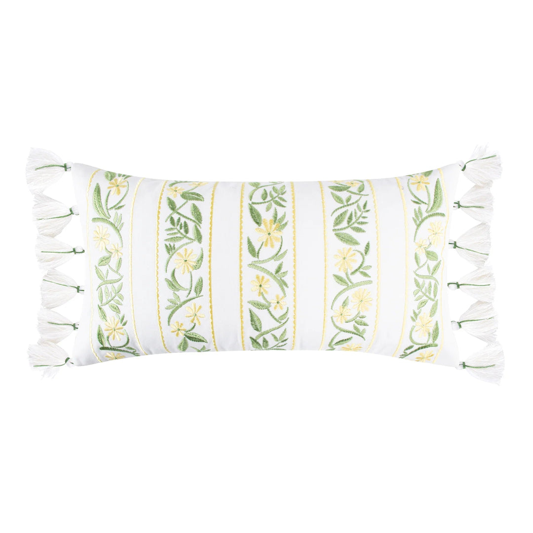 Decorative pillow with floral pattern and tassel trim on a white background