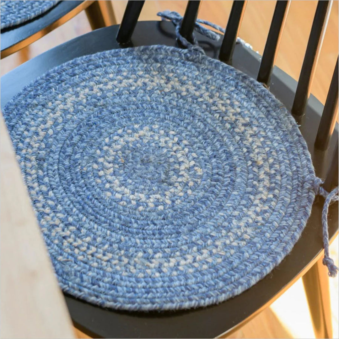 Blue braided chair pad on a wooden chair