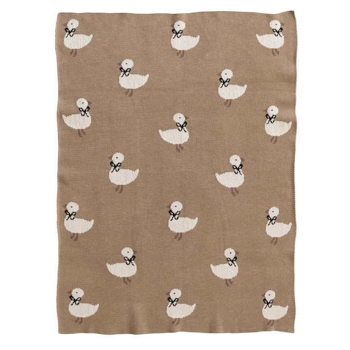Brown blanket with white duck pattern on a white background