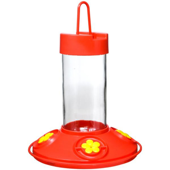Red and clear hummingbird feeder on a white background