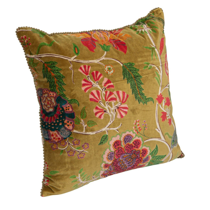 Decorative pillow with floral embroidery on a white background