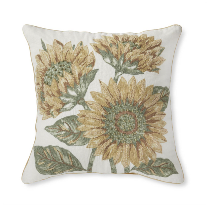 Decorative pillow with sunflower pattern on a white background