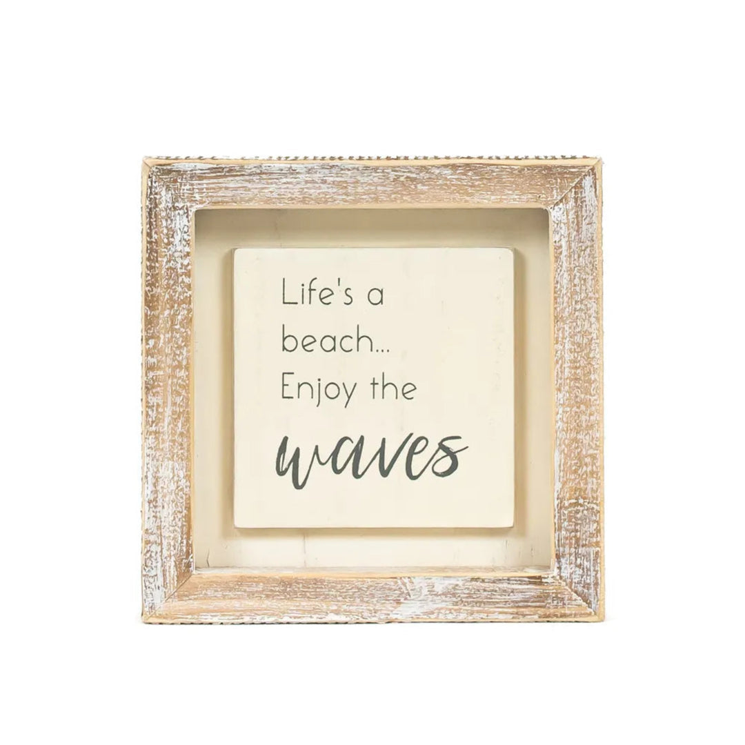 Framed motivational quote 'Life's a beach... Enjoy the waves' on a white background