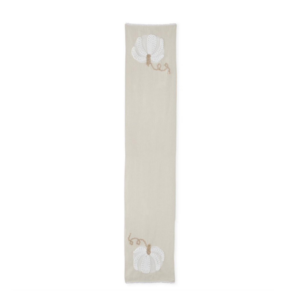 Textile with embroidered designs on a white background