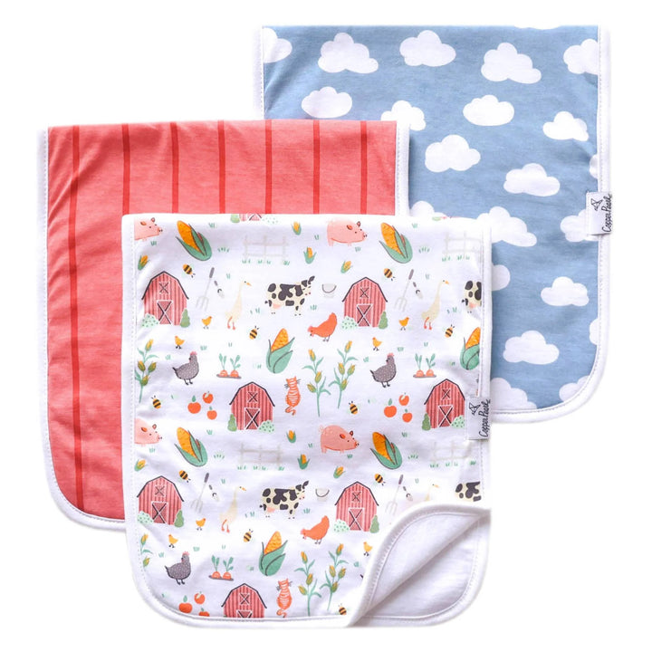Three baby blankets with different patterns on a white background