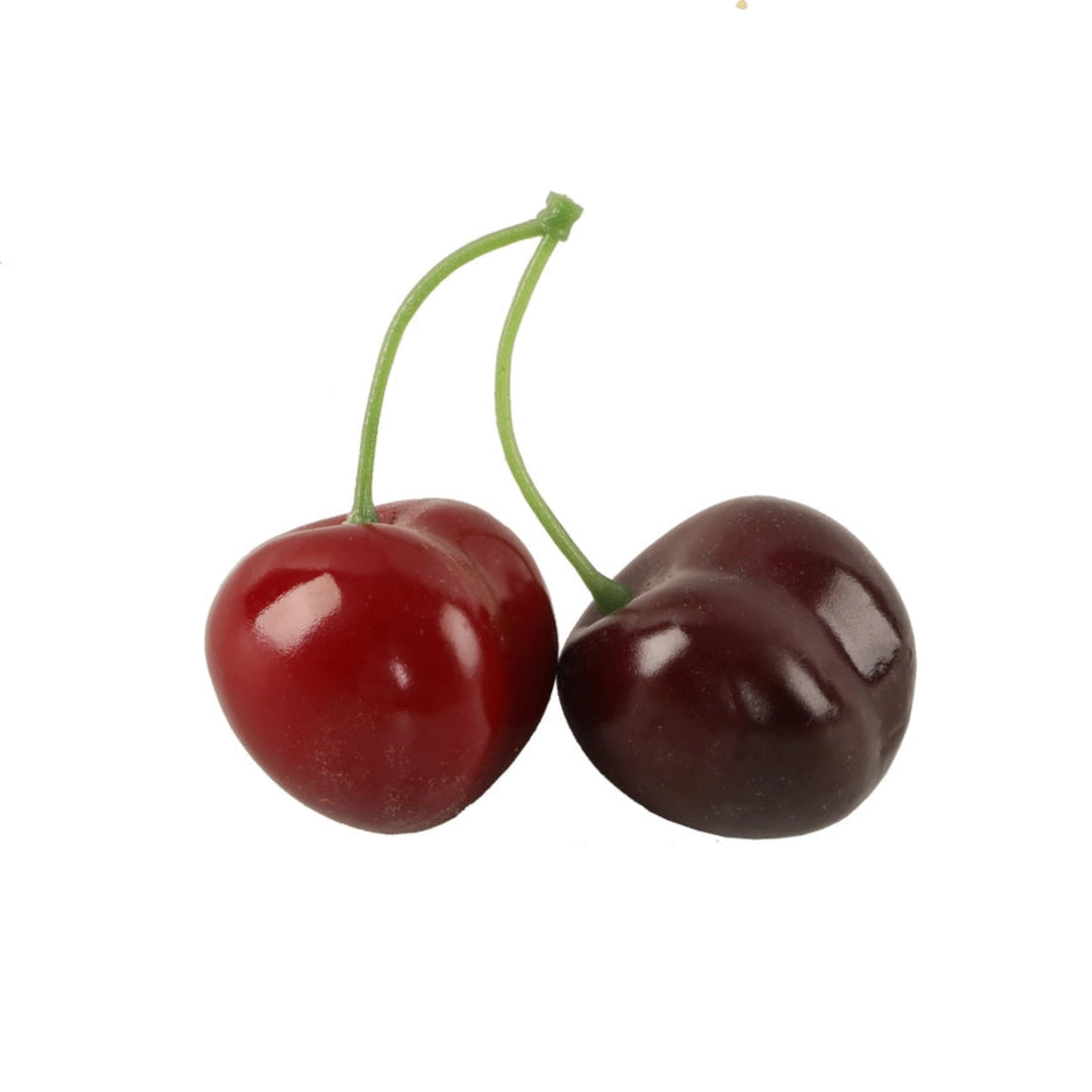 Two cherries on a white background