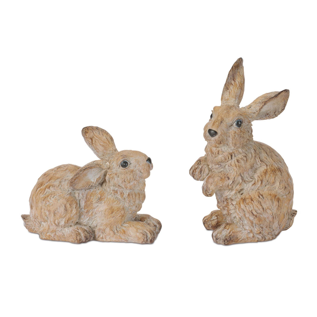 Two decorative rabbit statues on a white background
