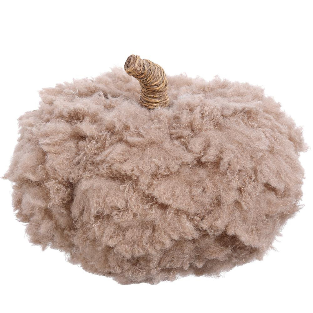 Fluffy beige pumpkin decoration on a white background