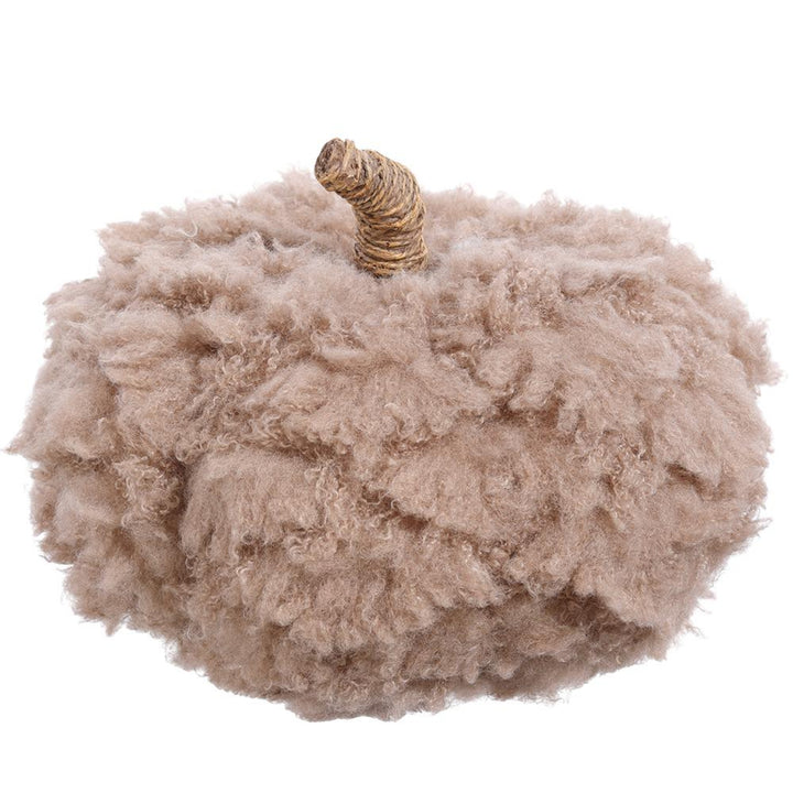 Fluffy beige pumpkin decoration on a white background