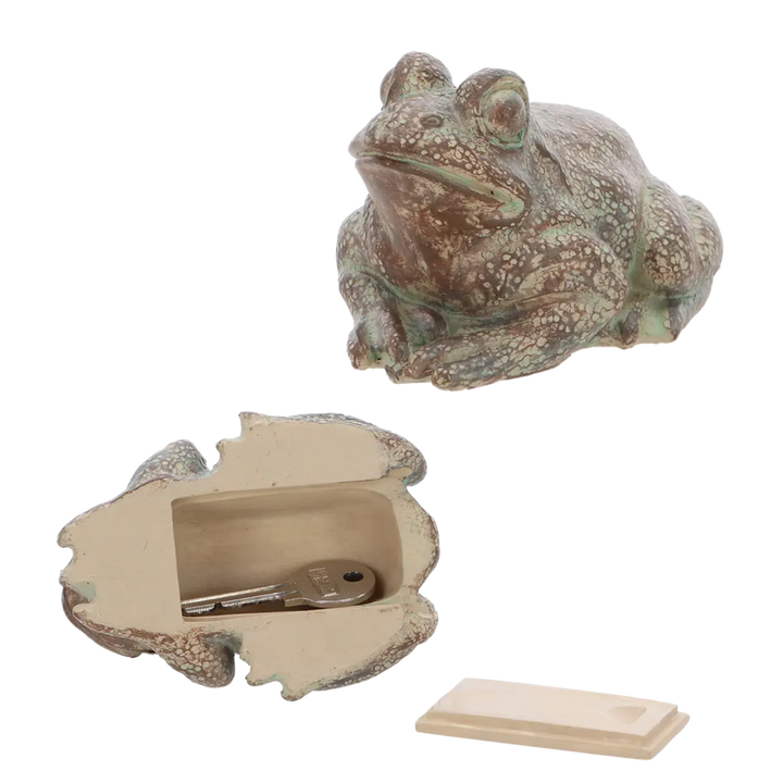Decorative frog-shaped box with a key inside on a white background