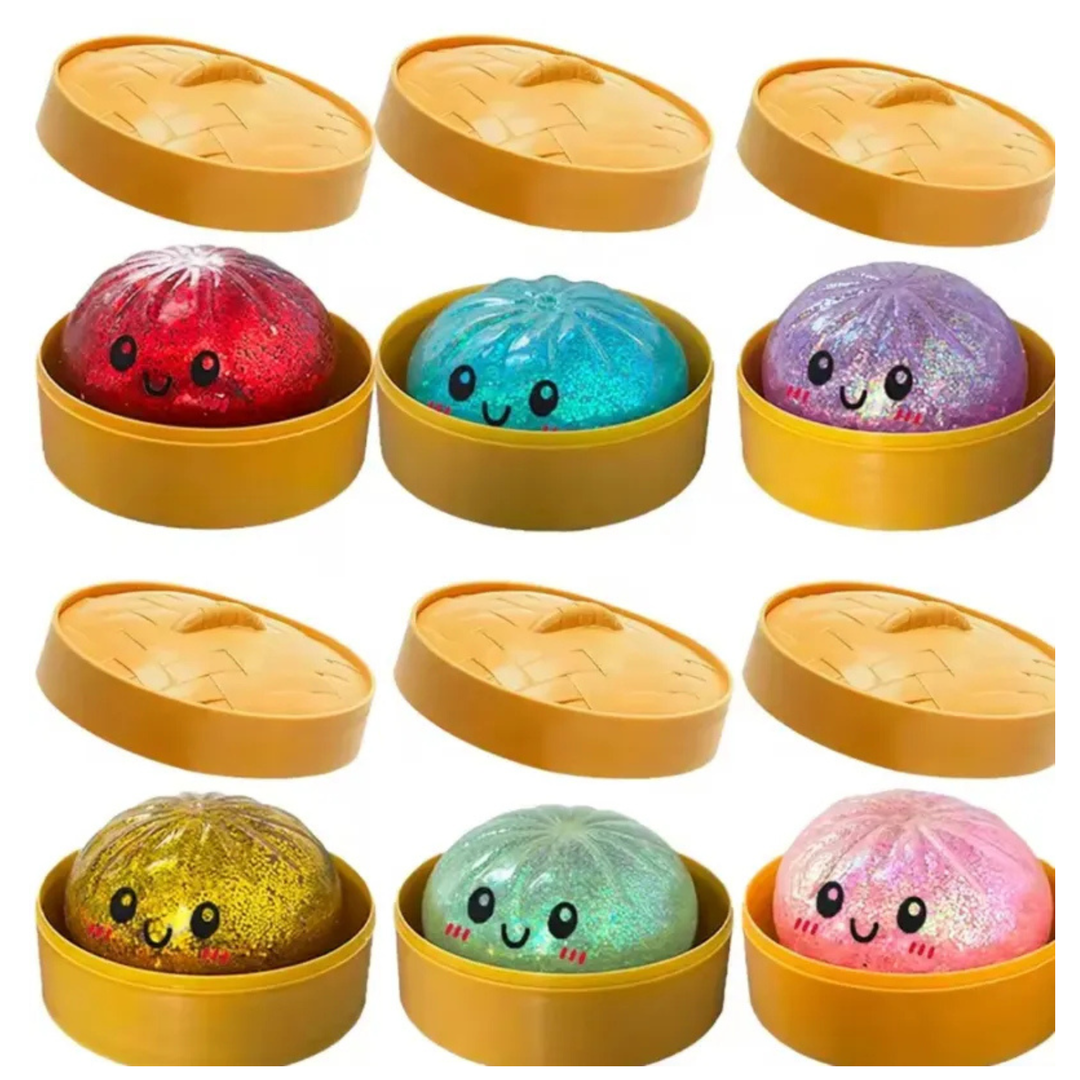 Set of colorful glittery balls with smiling faces in yellow containers on a white background